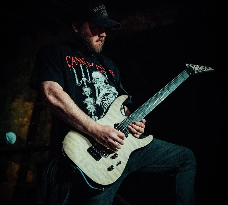 Chayse Burmeister playing guitar